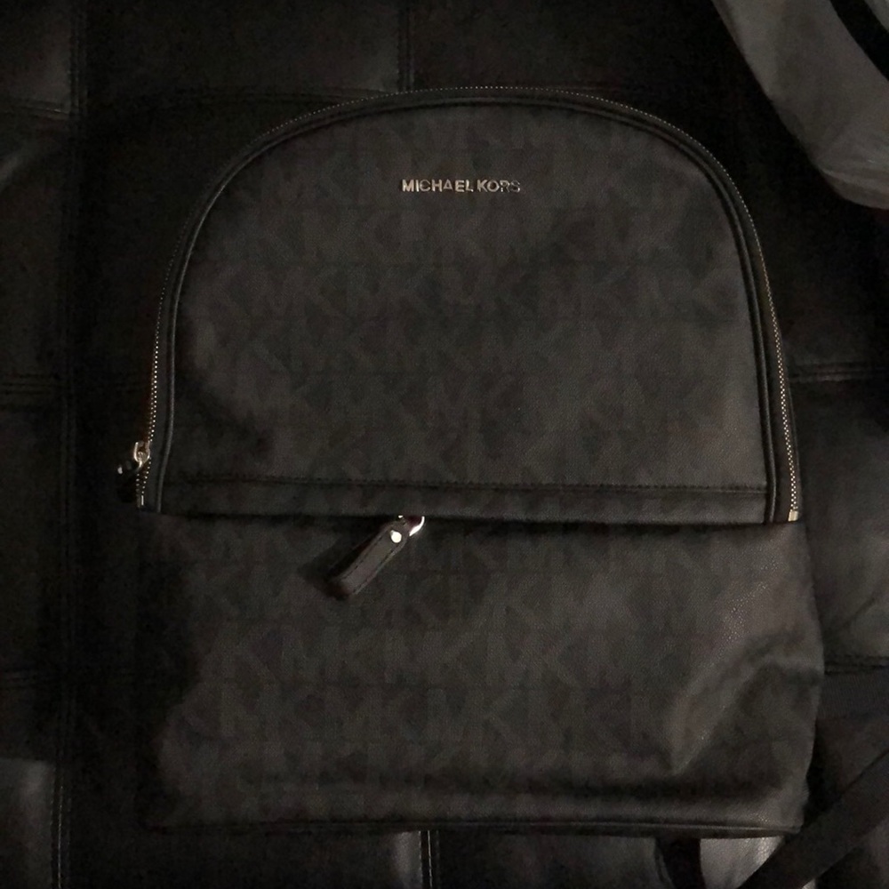 Mk black monogrammed backpack. Measurements 13.75 H , 5. 1/2 D , 13.0 W